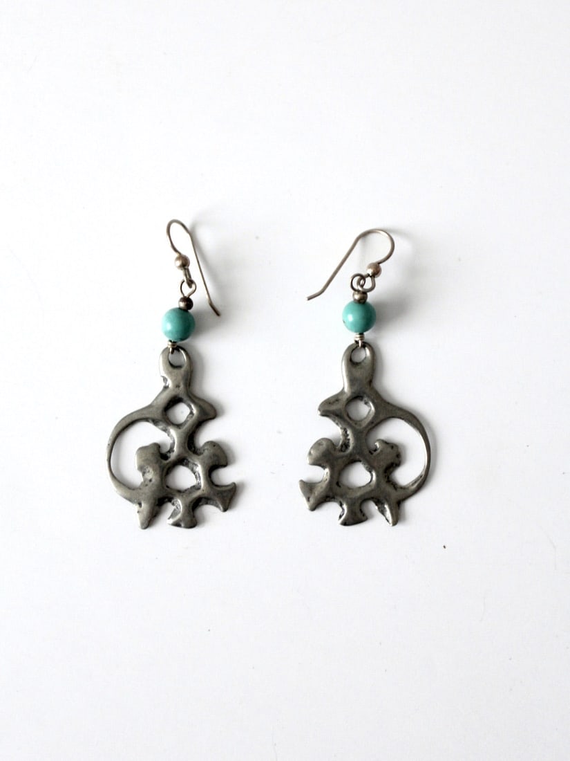 Vintage Boho Abstract Drop Earrings with Blue-Green Bead: Vintage Boho Abstract Drop Earrings with Blue-Green Bead Elevate your accessory collection with this pair of vintage boho drop earrings. Crafted in an abstract design, these earrings showcase a striki