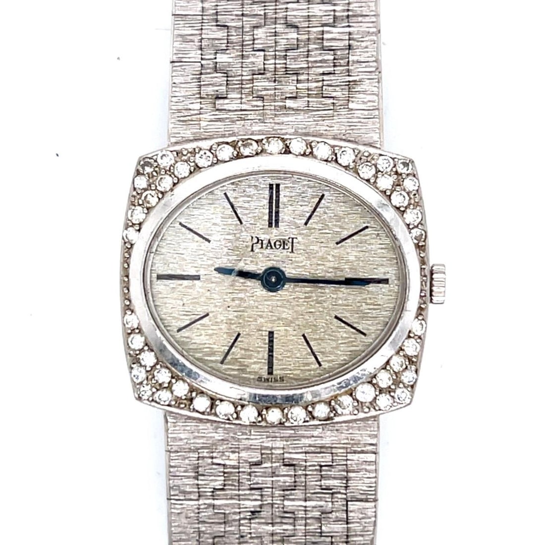 Ladies Manual Wind 18K White Gold Watch with Diamond Accents by Piaget: Ladies Manual Wind 18K White Gold Watch with Diamond Accents by Piaget This Piaget ladies watch is crafted from 18K white gold and features a manual winding movement. The watch is adorned with 46 diam