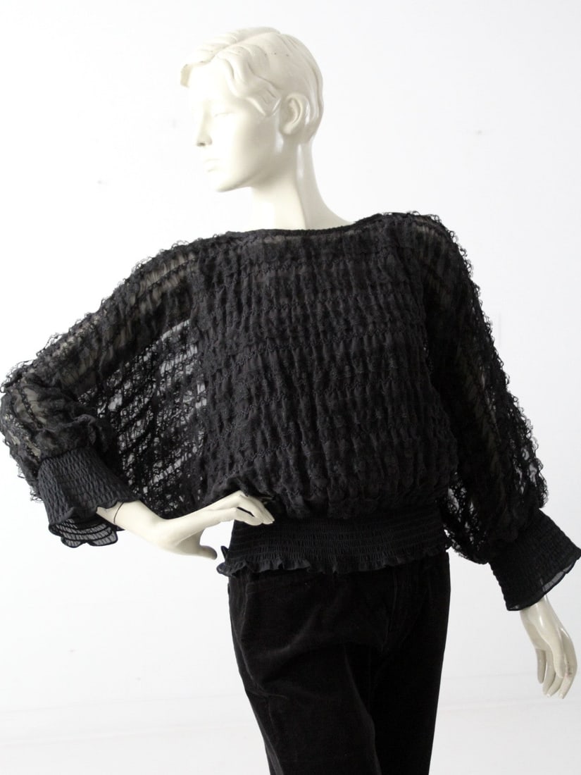 1970s Andree Gaye Sheer Ruffle Blouse with Camisole: 1970s Andree Gaye Sheer Ruffle Blouse with Camisole Step back into the vibrant 1970s with this Vintage Andree Gaye Ruffle Blouse, a stunning piece designed for The Shirt Off My Back. This sheer blouse