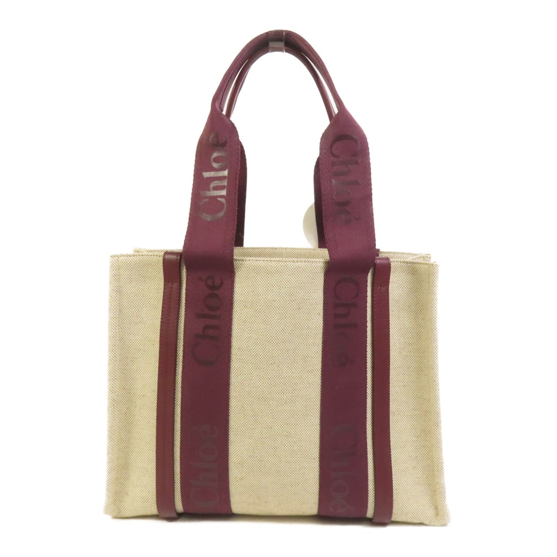 Chloe Medium Woody Canvas Tote in Beige and Red: Chloe Medium Woody Canvas Tote in Beige and Red This Chloe Woody tote bag features a canvas exterior in beige with red accents. Designed for women, it offers a medium size with ample space, making it 
