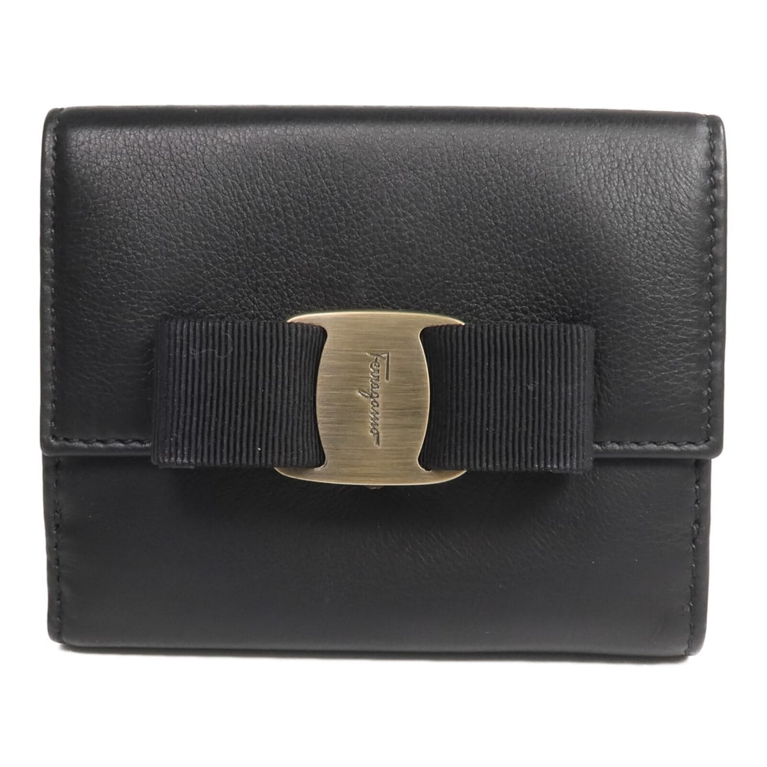Salvatore Ferragamo black calfskin bi-fold wallet GHW: Salvatore Ferragamo black calfskin bi-fold wallet GHW This Salvatore Ferragamo bi-fold wallet is crafted from black calfskin leather and features gold hardware. Designed for women, it offers a sophist