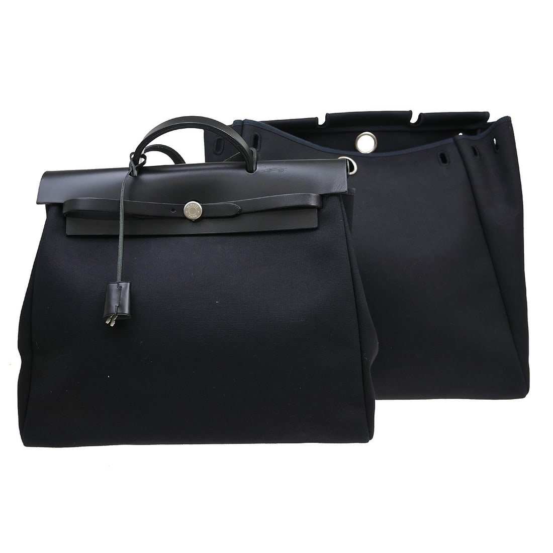 Hermes Herbag MM Black Toile Officier Handbag: Hermes Herbag MM Black Toile Officier Handbag This Hermes Herbag MM handbag features a black Toile Officier exterior and a medium-sized silhouette. Designed for casual occasions, it offers a canvas li