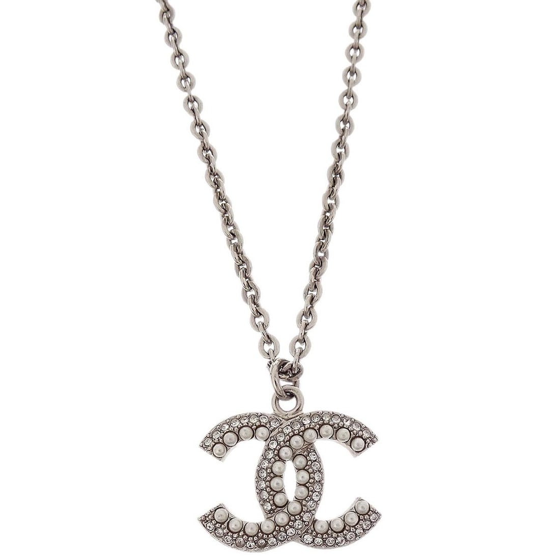 Chanel F19K Silver Plated Necklace With CC Pendant and Rhinestone Pearl: Chanel F19K Silver Plated Necklace With CC Pendant and Rhinestone Pearl This Chanel CC chain necklace features a silver-plated pendant adorned with artificial pearls and rhinestones. The elegant desig