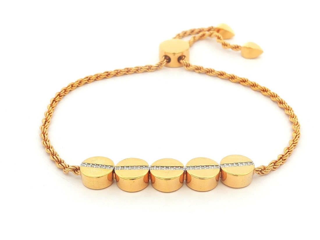 Monica Vinader Diamond Bead Adjustable Rope Bracelet: Monica Vinader Diamond Bead Adjustable Rope Bracelet This adjustable friendship bracelet features a beaded design crafted from solid 18k yellow gold vermeil. It is adorned with approximately 35 natura