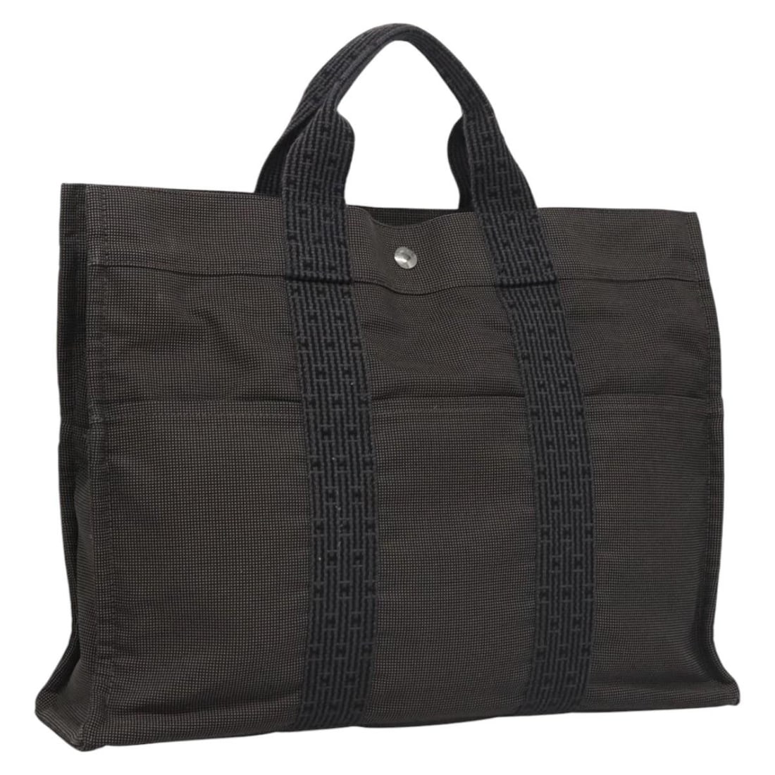 Fourre-tout Herline Gray Canvas Tote Bag by Hermes France: Fourre-tout Herline Gray Canvas Tote Bag by Hermes France The Hermes Fourre-tout Herline Canvas is a gray women's bag featuring durable canvas construction. Designed for everyday use, it offers ample 