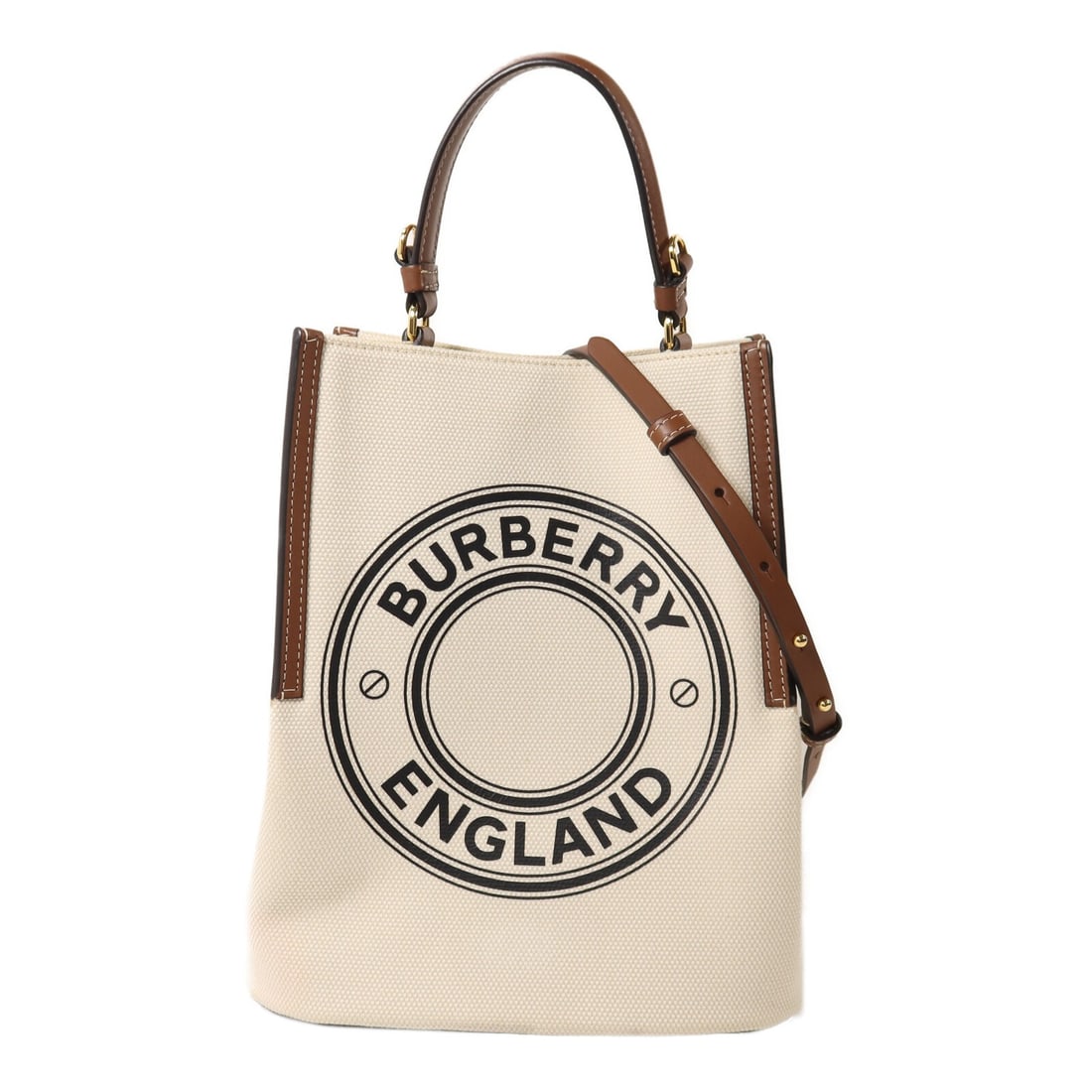 Burberry Peggy Canvas Beige 2 Way Shoulder Bag: Burberry Peggy Canvas Beige 2 Way Shoulder Bag This Burberry Small Peggy Bucket Bag is crafted from beige canvas and designed as a versatile 2-way shoulder bag. It features a structured silhouette wit