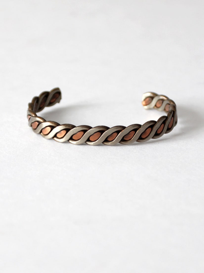 Vintage Southwestern Mixed Metal Cuff Bracelet Copper Silver Tone: Vintage Southwestern Mixed Metal Cuff Bracelet Copper Silver Tone Discover the allure of this vintage mixed metal cuff bracelet that beautifully merges Southwestern charm with timeless elegance. This 