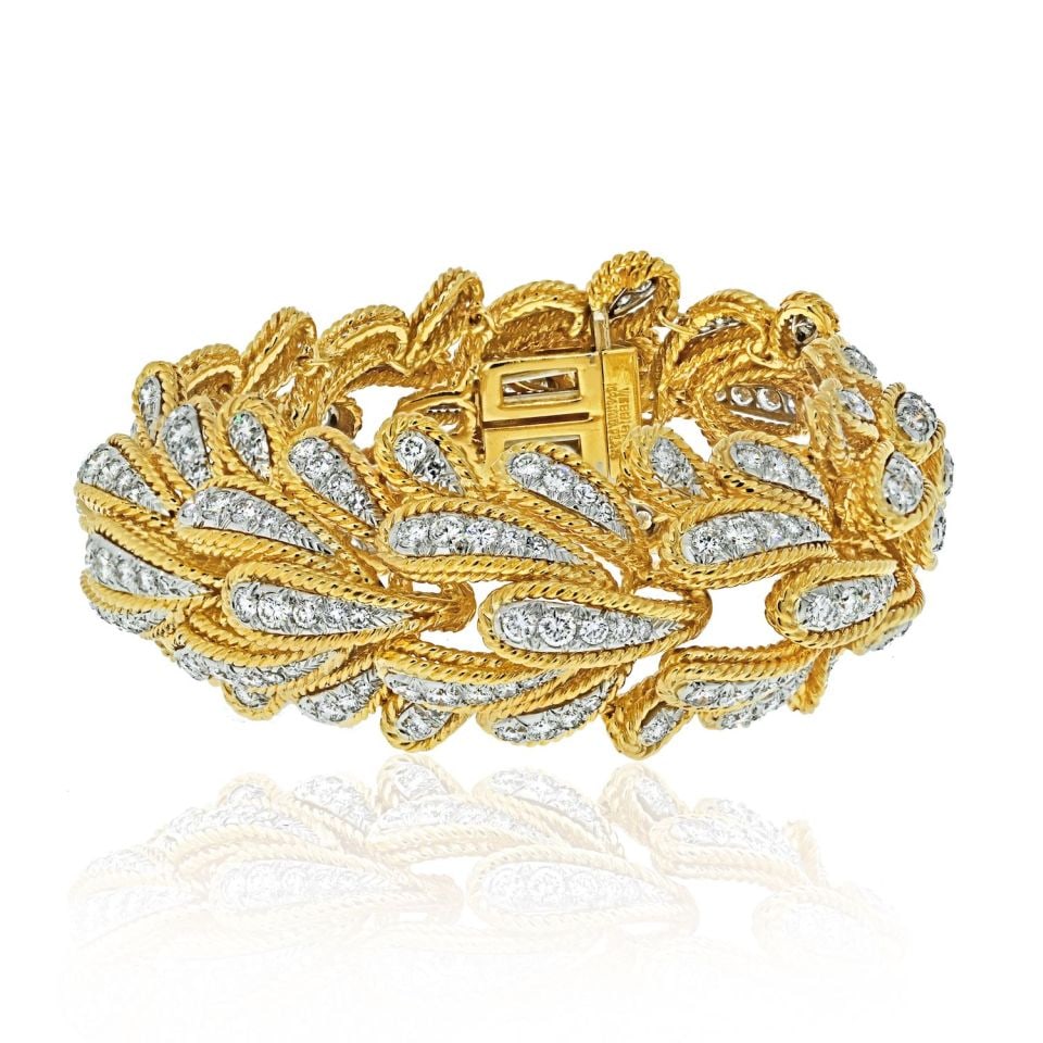 David Webb Bombe Diamond Bracelet Platinum 18K Gold 15.00cttw Leaf Motif: David Webb Bombe Diamond Bracelet Platinum 18K Gold 15.00cttw Leaf Motif Discover the elegance of the David Webb Platinum & 18K Yellow Gold Bombe Diamond Leaf Motif Bracelet. This exquisite piece show