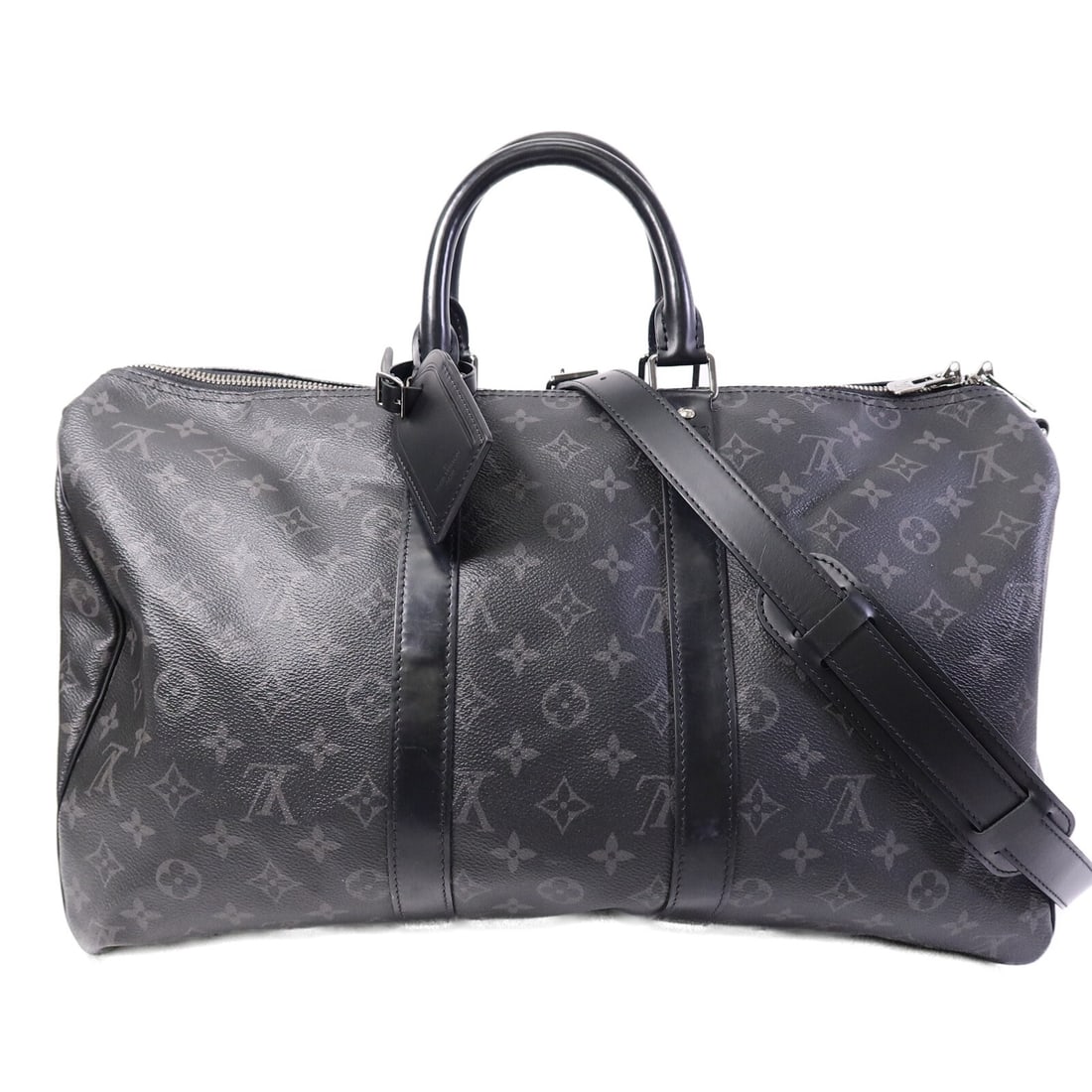 Louis Vuitton Keepall 45 Monogram Eclipse 2way Shoulder Bag: Louis Vuitton Keepall 45 Monogram Eclipse 2way Shoulder Bag This Louis Vuitton Keepall 45 Bandouliere shoulder bag features the iconic Monogram Eclipse pattern in black PVC coated canvas. Designed for