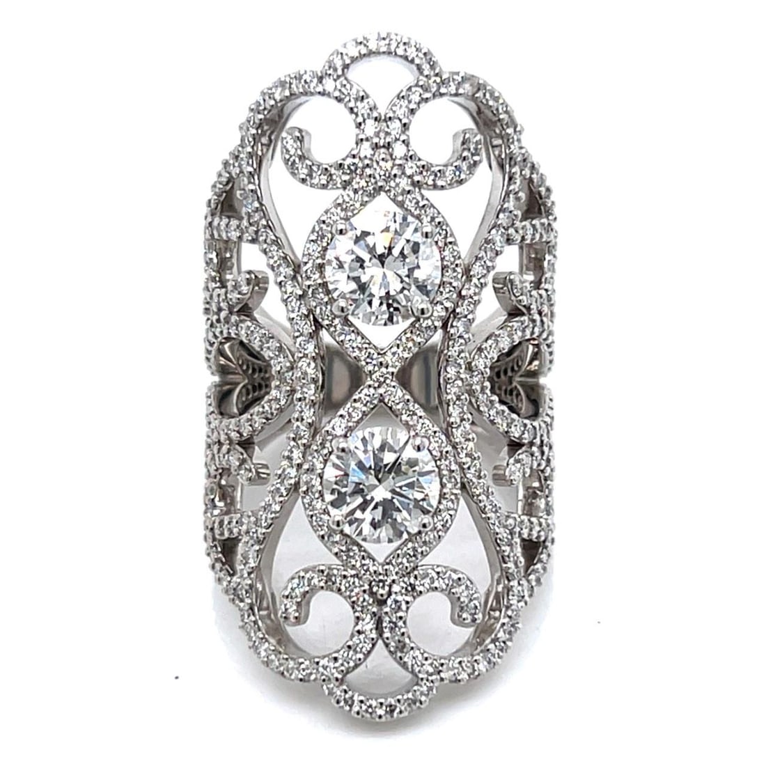 18K White Gold 6.40 Ct Diamond Ring with 376 Diamonds: 18K White Gold 6.40 Ct Diamond Ring with 376 Diamonds This exquisite 18K white gold diamond ring features a stunning total diamond weight of 6.40 carats. The centerpiece includes 2 diamonds, approxima
