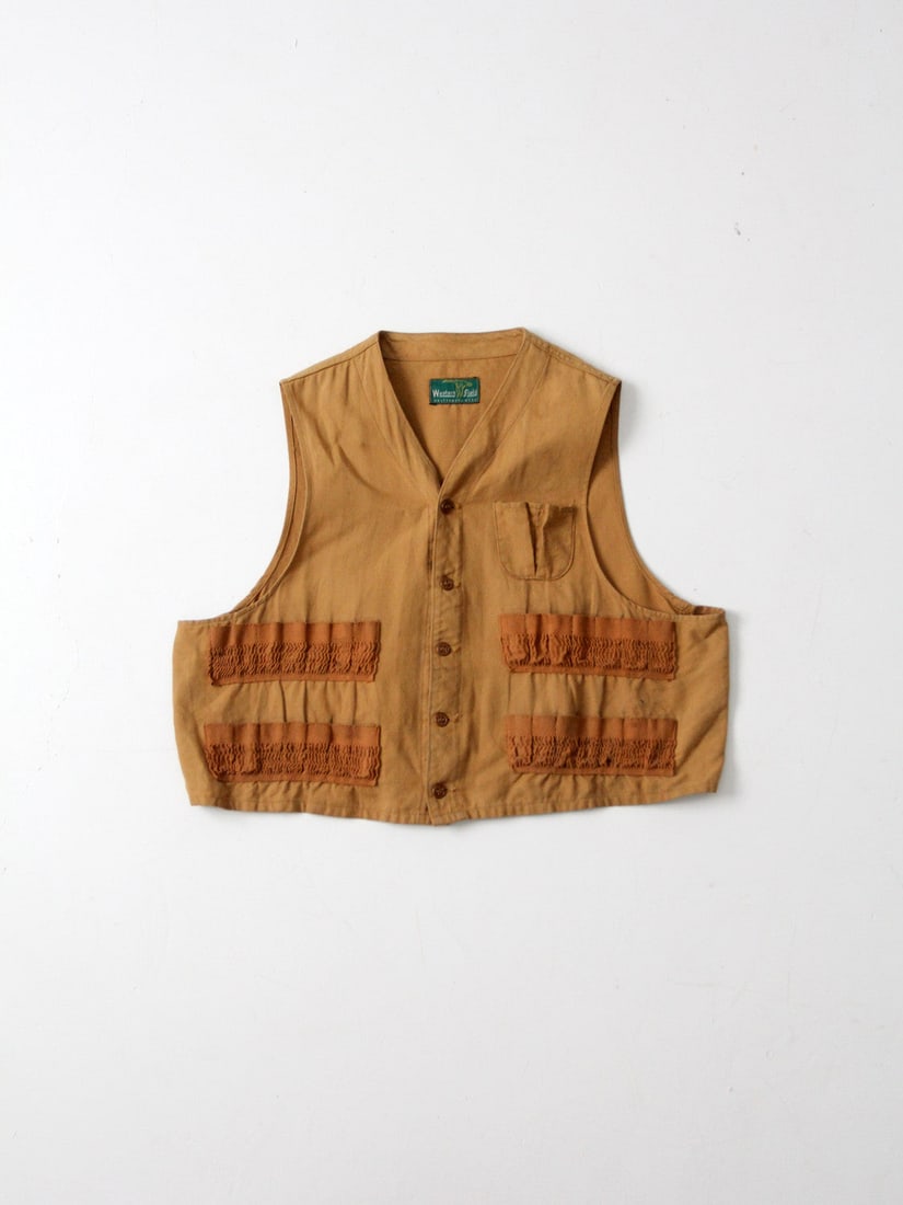 1950s Vintage Western Field Hunting Vest by Montgomery Ward: 1950s Vintage Western Field Hunting Vest by Montgomery Ward Discover a classic piece of outdoor apparel with this 1950s Vintage Western Field Montgomery Ward Hunting Vest. Crafted from durable tan can