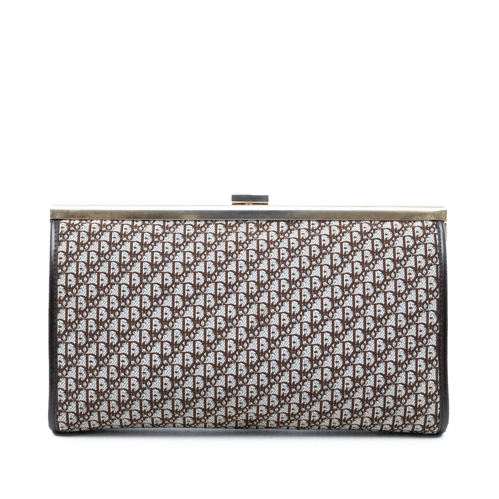 Dior Diorissimo Trotter Brown Canvas Clutch with Leather Trim: Dior Diorissimo Trotter Brown Canvas Clutch with Leather Trim This Diorissimo Trotter Canvas Clutch features a canvas body with leather trim and a top clasp closure. The clutch shows signs of use, inc