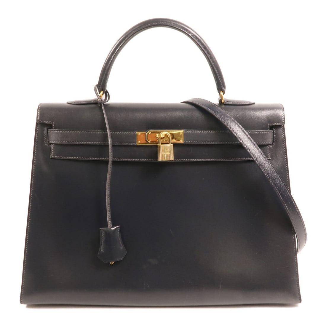 Black Box Calf Leather Kelly 35 Gold Hardware 2way Shoulder Bag by Hermes: Black Box Calf Leather Kelly 35 Gold Hardware 2way Shoulder Bag by Hermes This Hermes Kelly 35 is a versatile 2-way shoulder bag crafted from luxurious black box calf leather. Designed for women, it f
