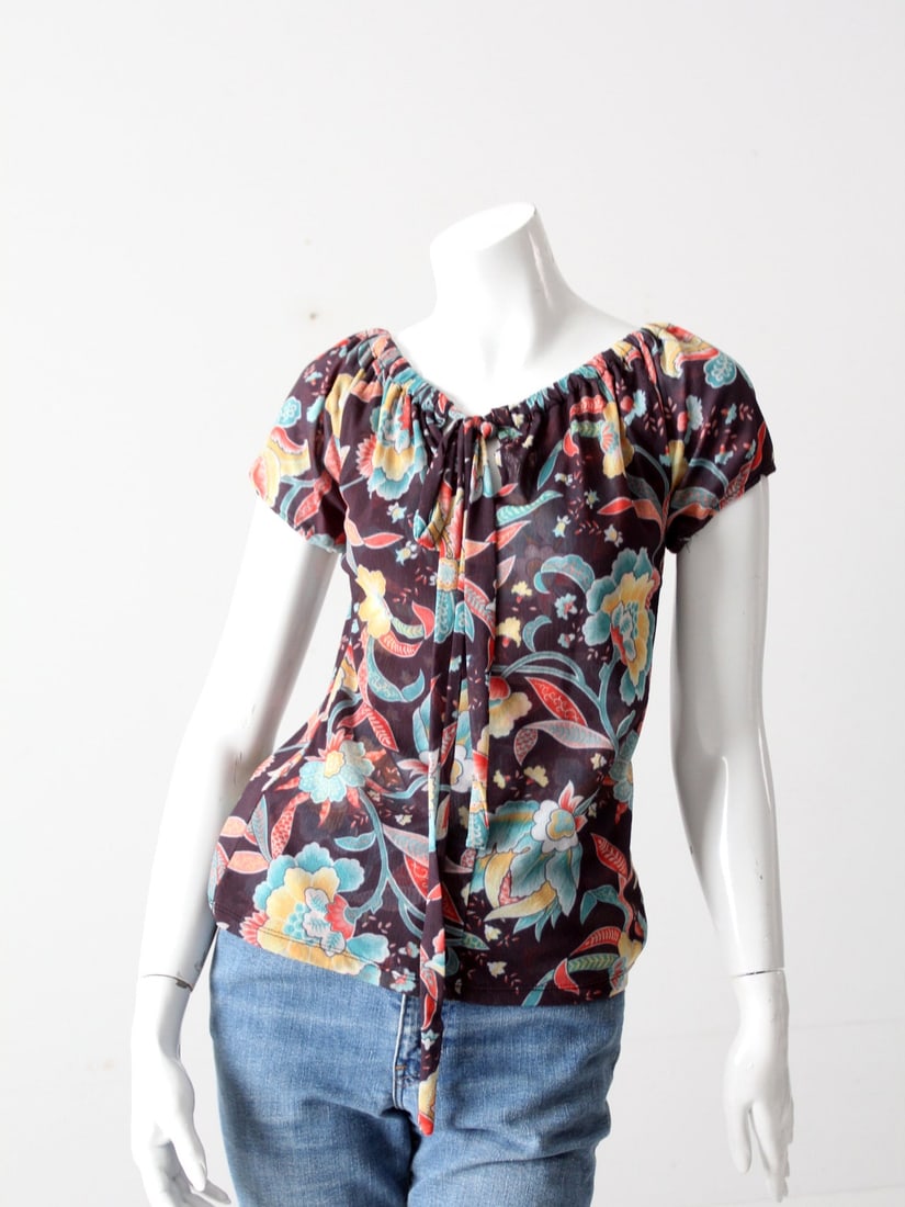 Vintage 90s Floral Stretch Mesh Top with Drawstring Closure: Vintage 90s Floral Stretch Mesh Top with Drawstring Closure Step out in style with this vintage late 90s stretch floral top, featuring a vibrant floral print on a black stretch mesh fabric. Designed f