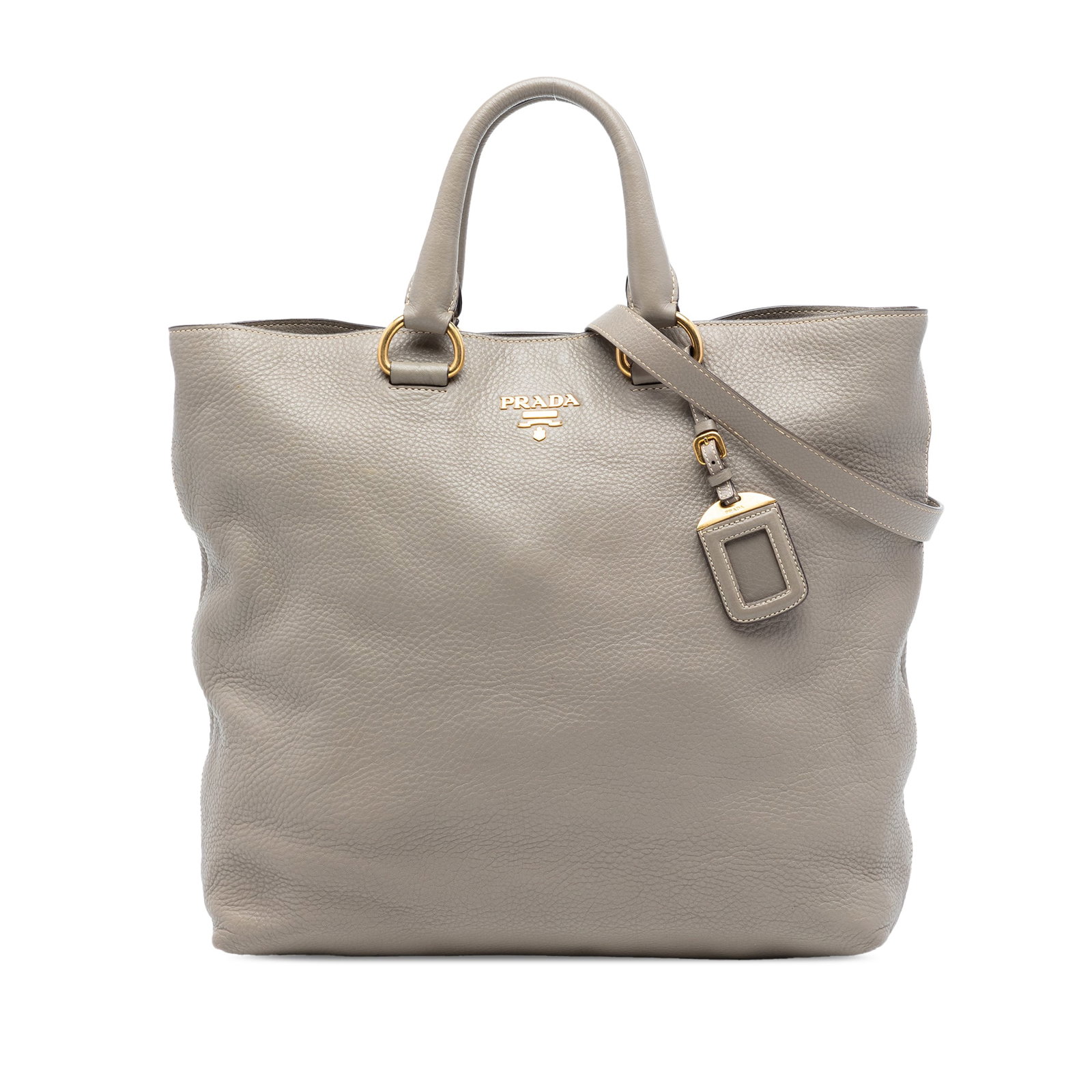 Prada Vitello Daino Gray Leather Convertible Satchel with Detachable Strap: Prada Vitello Daino Gray Leather Convertible Satchel with Detachable Strap This Prada Vitello Daino Open Convertible Tote is crafted from leather and features rolled leather handles, a detachable flat