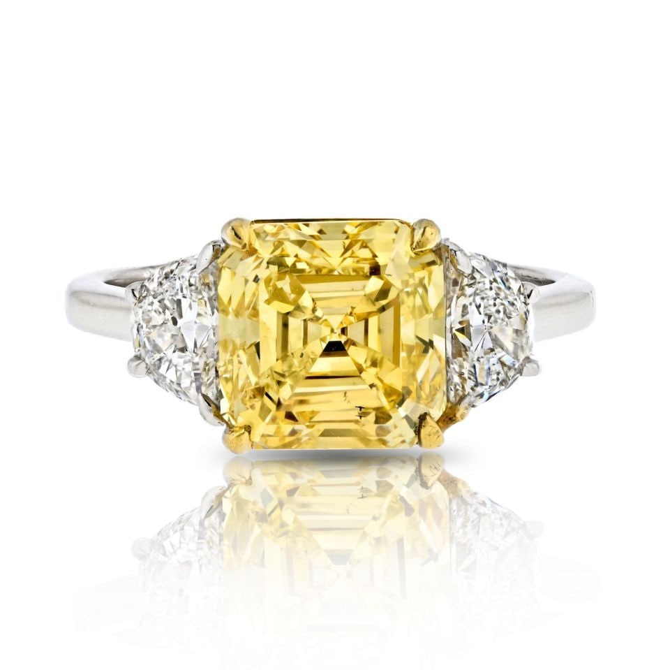3.38ct Fancy Vivid Yellow Asscher Cut Three Stone Engagement Ring: 3.38ct Fancy Vivid Yellow Asscher Cut Three Stone Engagement Ring Celebrate your love with this stunning 3.38-carat Fancy Vivid Yellow Asscher Cut Three Stone Diamond Engagement Ring. Meticulously des