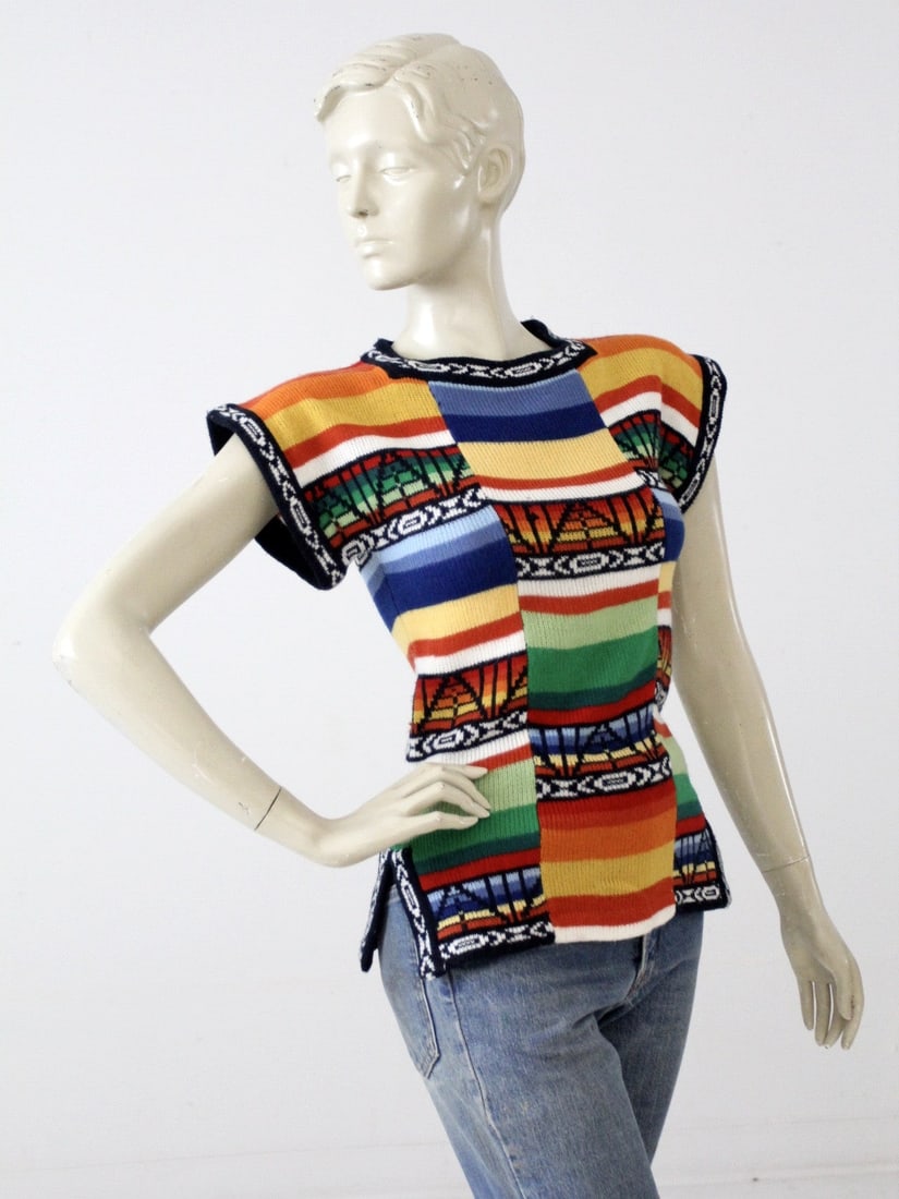 1970s Coil Age Vintage Boho Knit Top Multi-Color Geometric Print: 1970s Coil Age Vintage Boho Knit Top Multi-Color Geometric Print Embrace the spirit of the 1970s with this Vintage Hippie Knit Top from Coil Age. This bohemian-inspired top features a bold multi-color