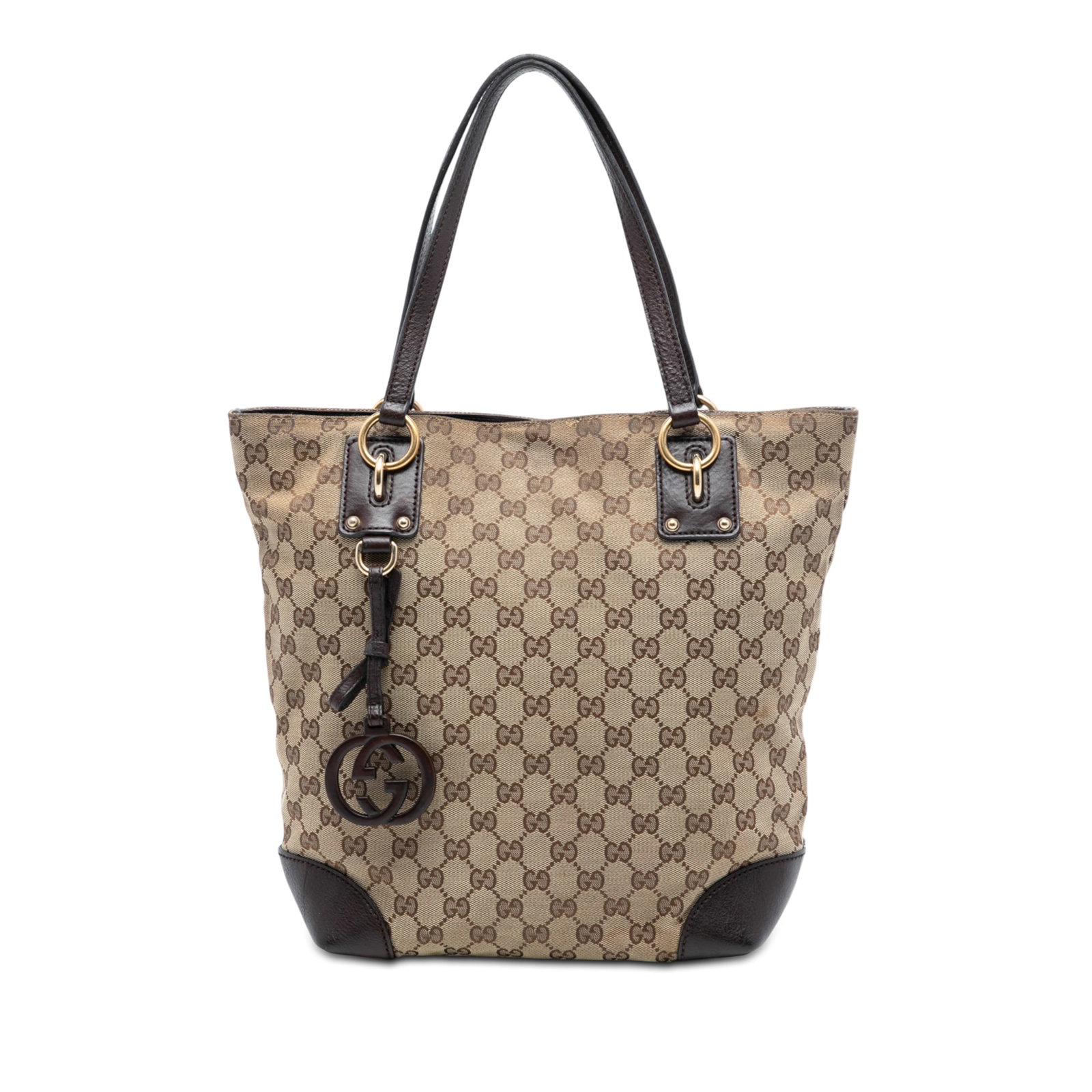 Beige GG Canvas Tote with Leather Trim and Charm by Gucci: Beige GG Canvas Tote with Leather Trim and Charm by Gucci This Gucci GG Canvas GG Charm Tote features a beige canvas body with leather trim, flat leather handles, and a GG charm accent. The bag includ