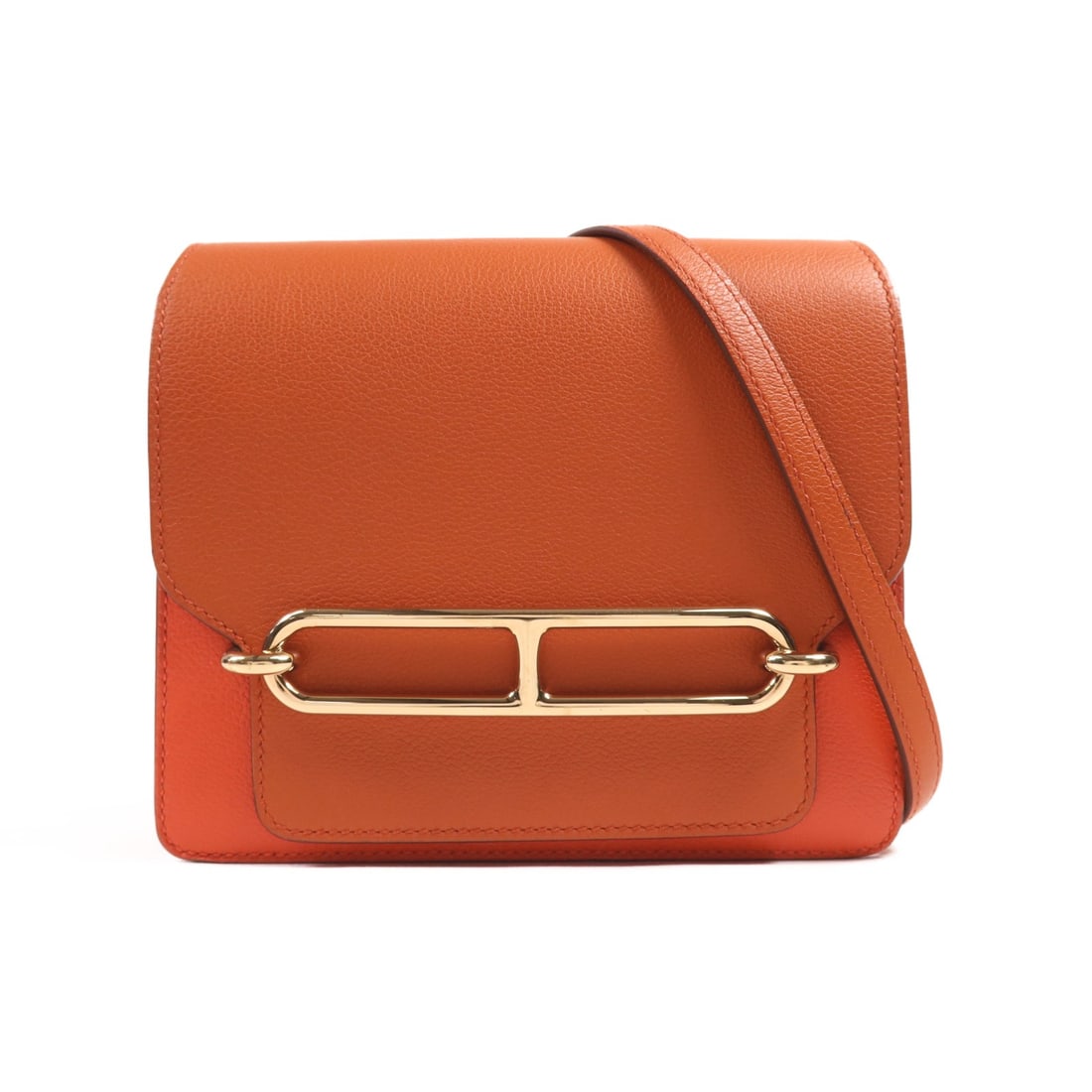 HERMES Mini Roulis Shoulder Bag Evercolor Leather Cuivre Capucine: HERMES Mini Roulis Shoulder Bag Evercolor Leather Cuivre Capucine This exquisite HERMES Mini Roulis Shoulder Bag is crafted from high-quality Evercolor calfskin leather in a stunning orange hue. With 