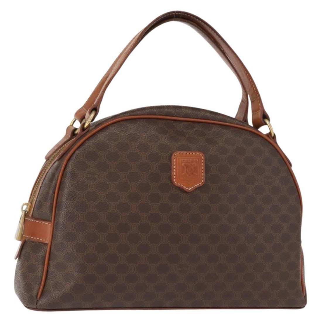 Vintage Macadam Brown Canvas and Leather Handbag by Celine: Vintage Macadam Brown Canvas and Leather Handbag by Celine This pre-owned Celine Vintage Macadam handbag is crafted from brown canvas with leather accents. It features a structured silhouette suitable