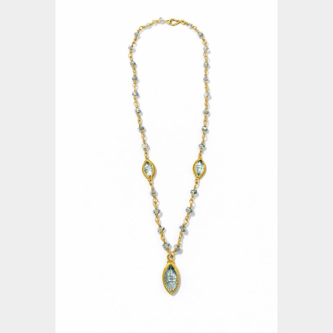 Aquamarine Gemstone Necklace in 22K Yellow Gold 18 Inch Length: Aquamarine Gemstone Necklace in 22K Yellow Gold 18 Inch Length This necklace is crafted from 22K yellow gold and features 30 aquamarines with a total approximate weight of 38.00 carats. The necklace m