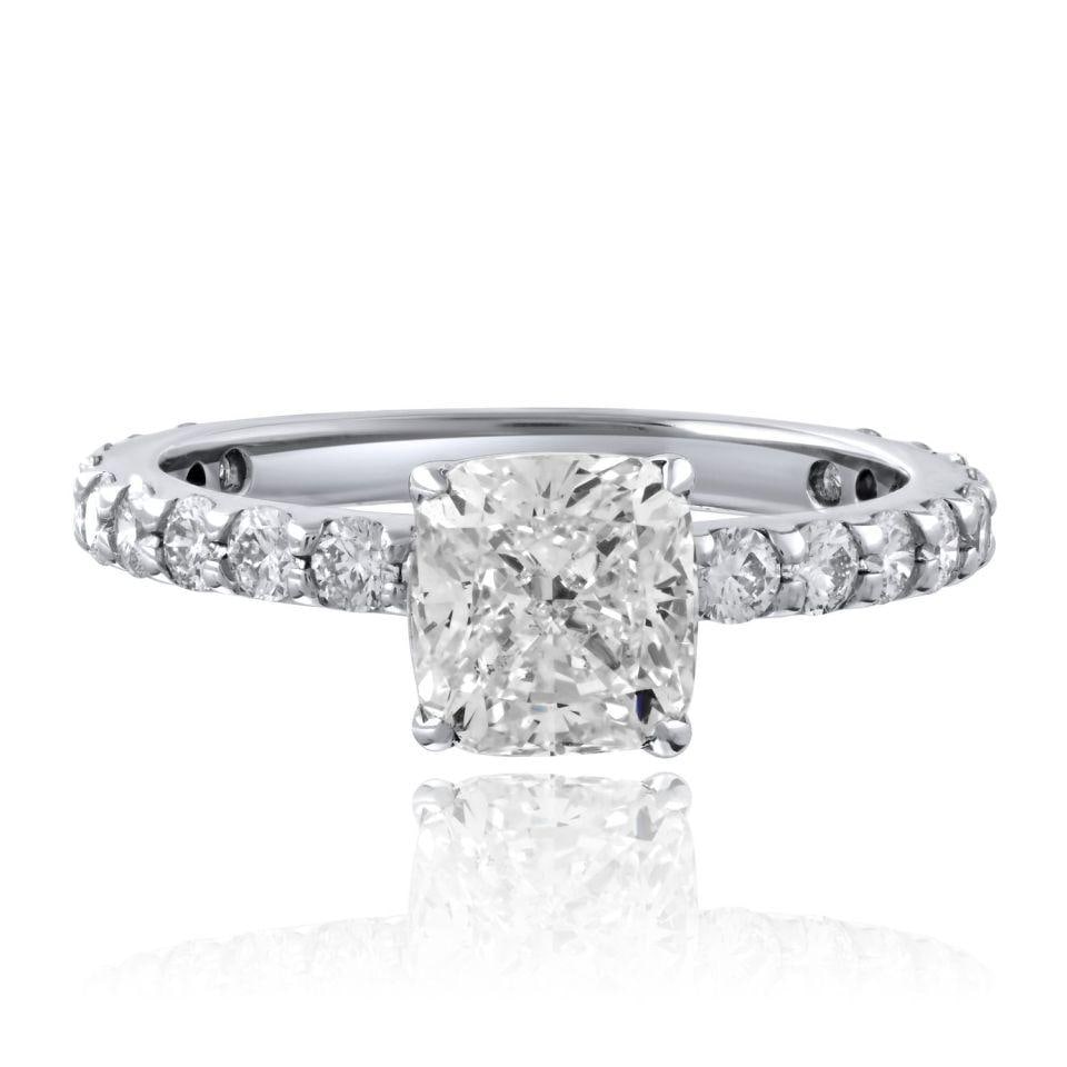Cushion Cut 1.42ct Diamond and Ten Round Brilliants 14K White Gold Ring: Cushion Cut 1.42ct Diamond and Ten Round Brilliants 14K White Gold Ring This ring features a 1.42 carat cushion cut diamond with G color and VS2 clarity, certified by GIA. It is crafted in 14K white g