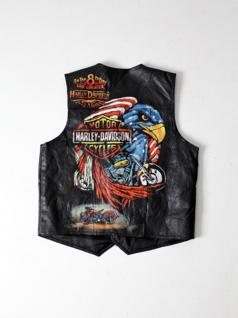Harley Davidson Hand-Painted Vintage Biker Vest Black Leather: Harley Davidson Hand-Painted Vintage Biker Vest Black Leather This vintage biker vest showcases a unique hand-painted design featuring iconic Harley Davidson artwork. Crafted from black leather, the v