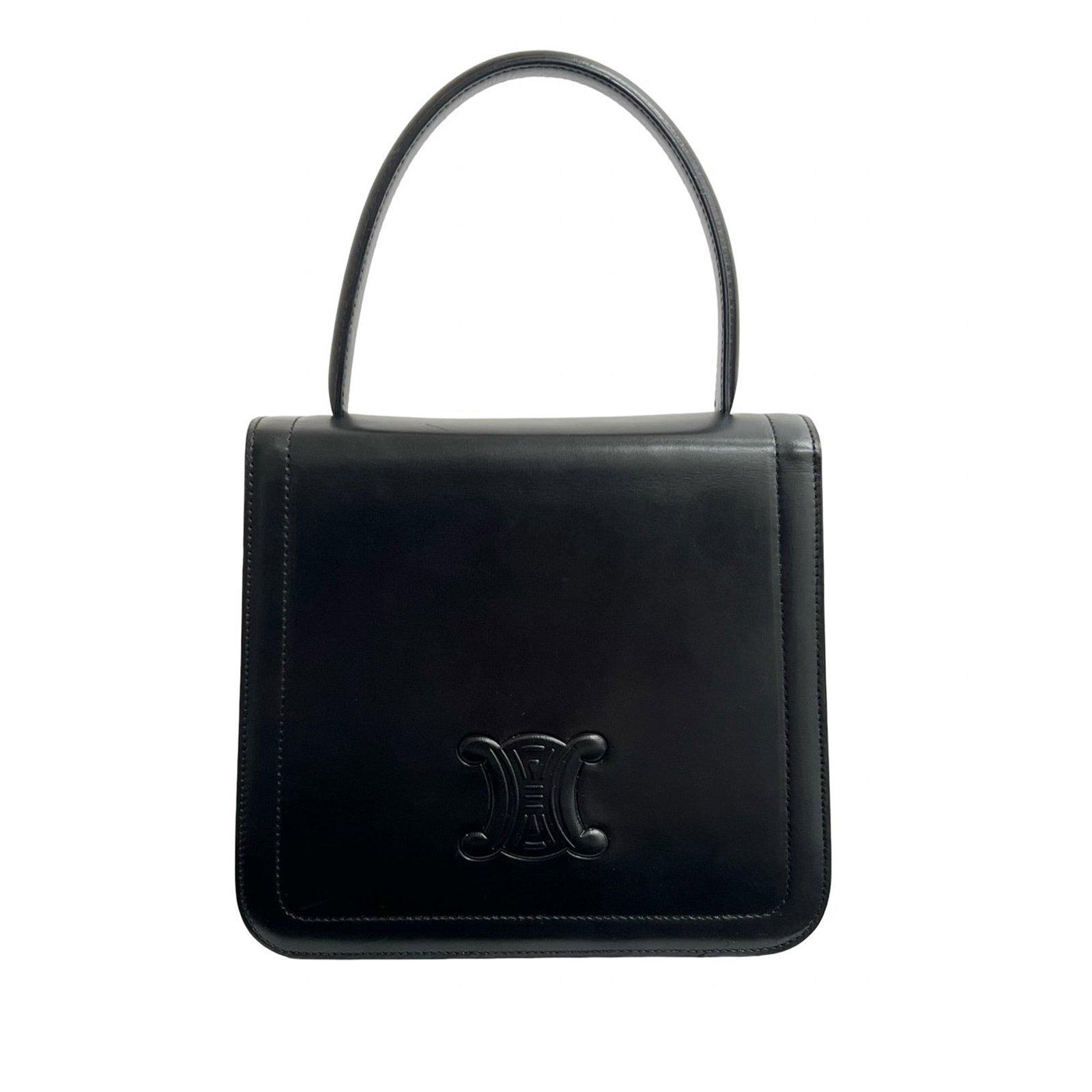 Celine Triomphe Black Leather Top Handle Bag: Celine Triomphe Black Leather Top Handle Bag The Celine Calfskin Triomphe Top Handle Bag is crafted from black leather and features a structured silhouette with a flat leather top handle. It includes 