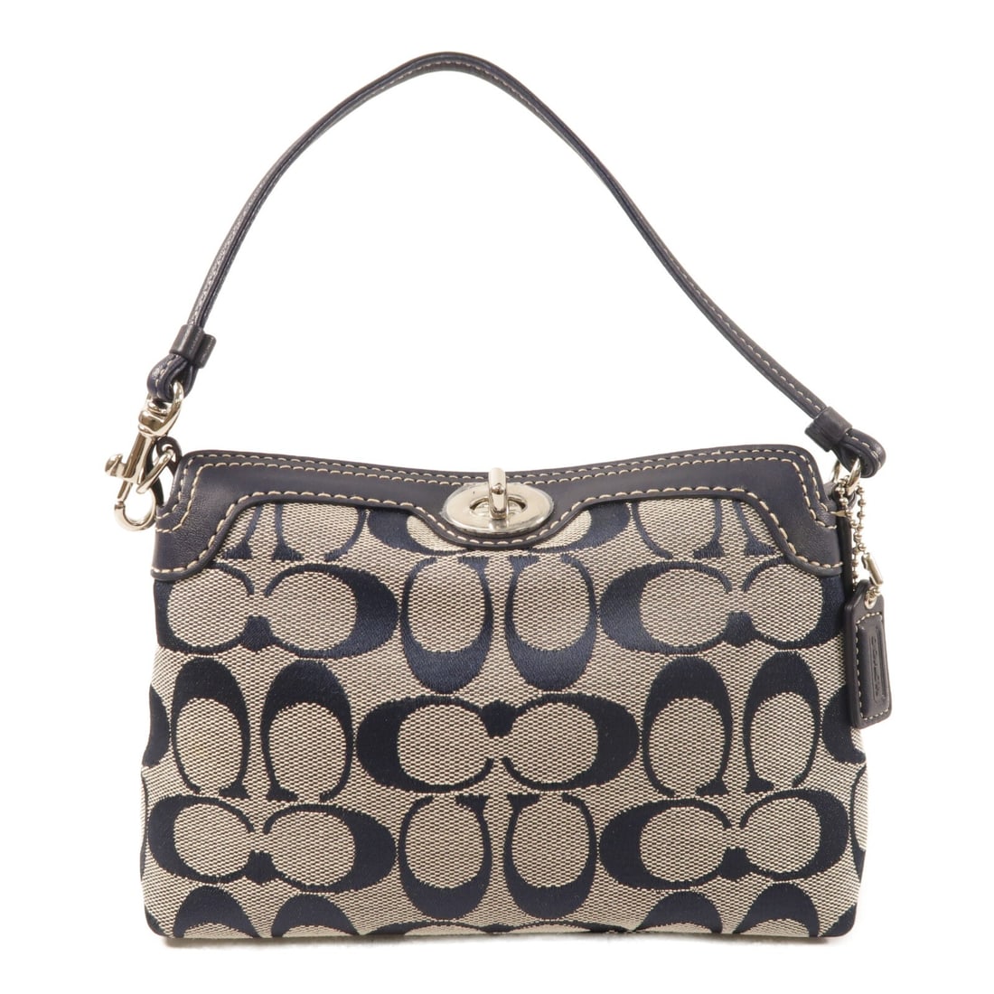 Coach Mini Canvas Handbag with Silver Turnlock Navy Blue: Coach Mini Canvas Handbag with Silver Turnlock Navy Blue This COACH mini handbag features a navy canvas exterior and a turnlock closure. Designed for women, it combines style and practicality in a com