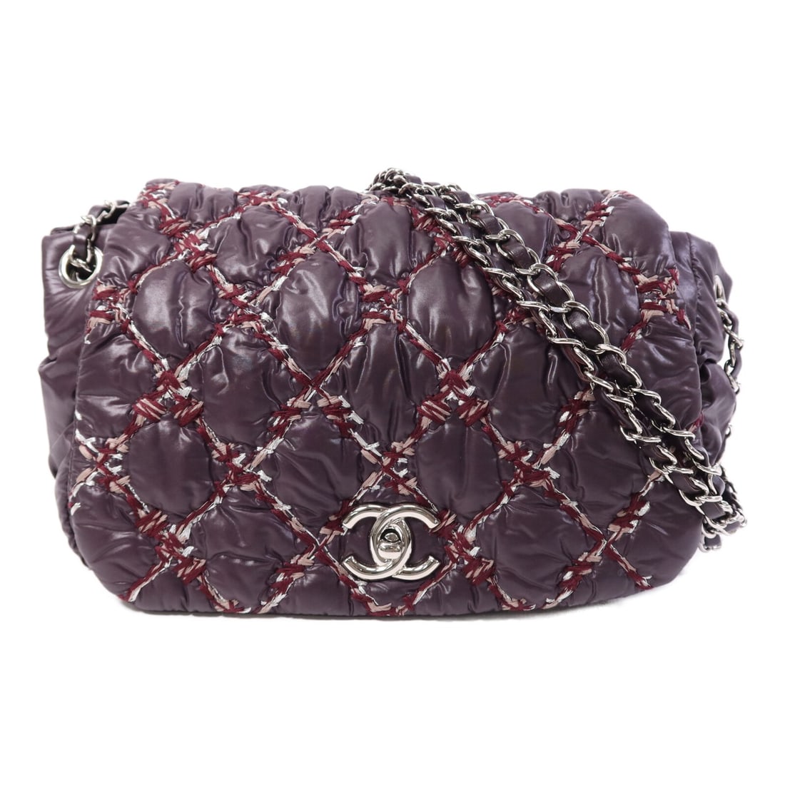 CHANEL Purple Nylon CC Chain Shoulder Bag: CHANEL Purple Nylon CC Chain Shoulder Bag This CHANEL shoulder bag features a distinctive purple nylon exterior with silver-tone hardware and the iconic CC logo. Designed for women, the bag offers a p