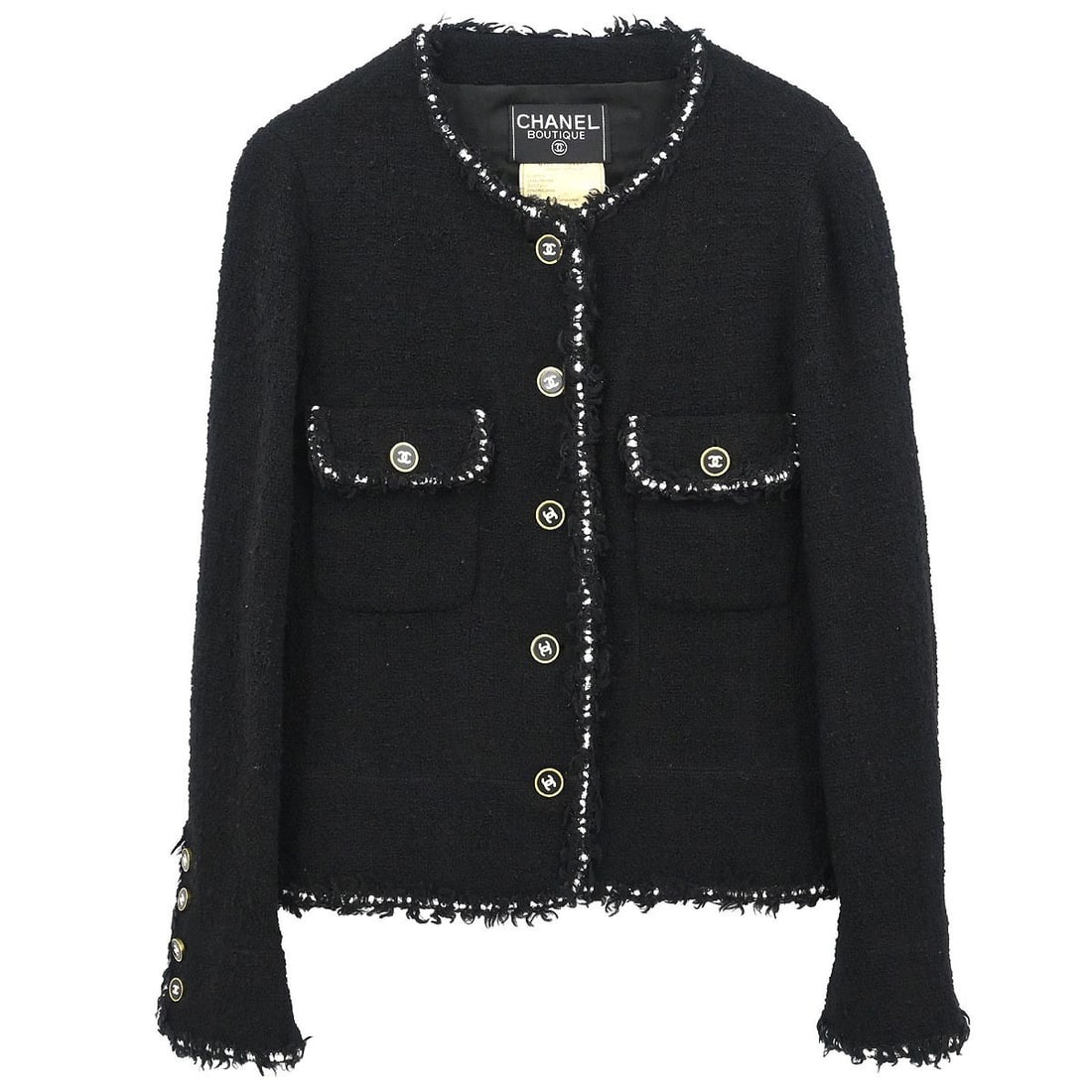 Black Wool Mid-Length Jacket by Chanel Size 44 with Logo Buttons: Black Wool Mid-Length Jacket by Chanel Size 44 with Logo Buttons This Chanel collarless single-breasted jacket is crafted from 100% wool in a classic black shade. Designed in a mid-length style, it fe