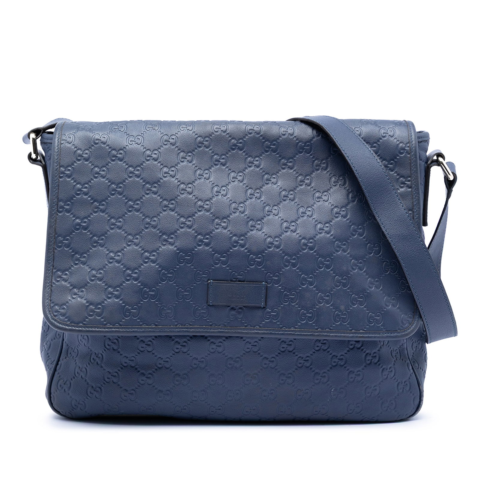 Gucci Guccissima Blue Embossed Leather Messenger Bag with Adjustable Strap: Gucci Guccissima Blue Embossed Leather Messenger Bag with Adjustable Strap This Guccissima Messenger Bag features a blue embossed leather body with an adjustable flat leather strap. The bag is designe