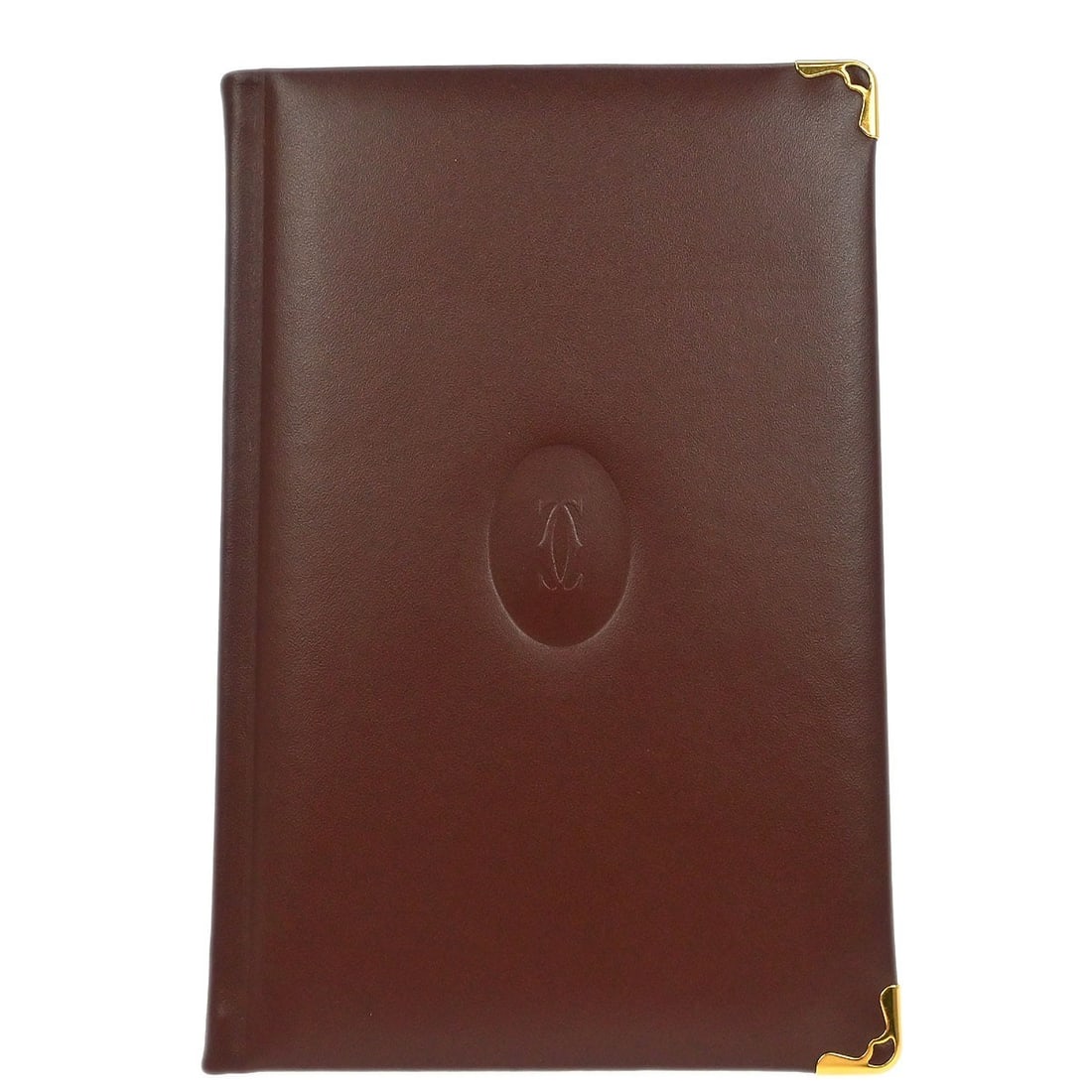 Small Cartier Leather Address Book in Bordeaux France: Small Cartier Leather Address Book in Bordeaux France This small address book features luxurious Bordeaux leather crafted by Cartier. Made in France, it is in very good condition both inside and out, 