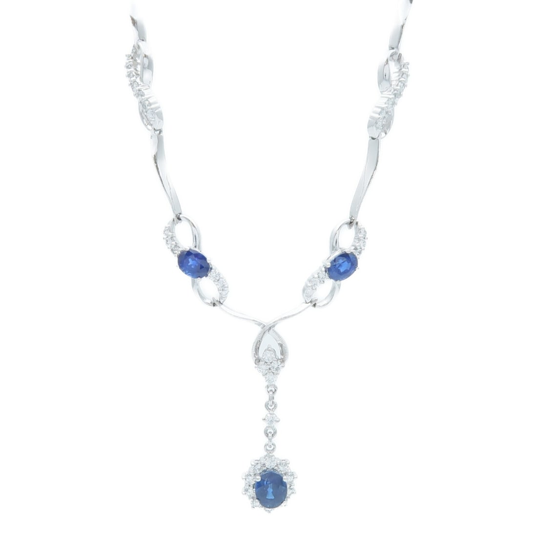 Blue Sapphire Diamond 18K White Gold Necklace: Blue Sapphire Diamond 18K White Gold Necklace This elegant necklace features a stunning sapphire as the main stone, set in 18K white gold. The piece is designed for women and showcases a beautiful blu