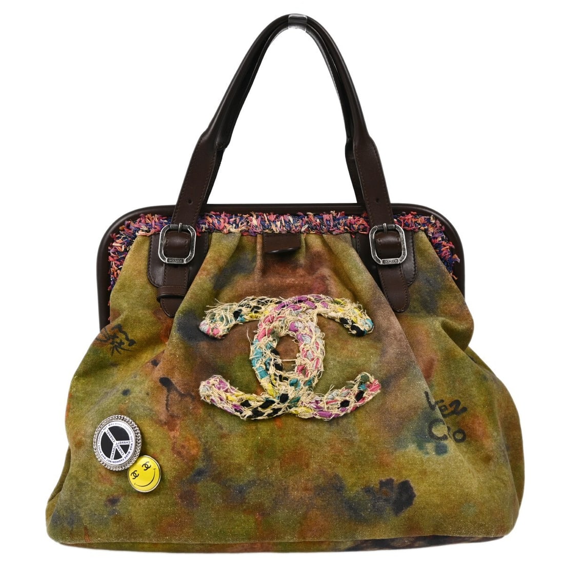 Chanel Khaki Green Graffiti Canvas Tote Handbag: Chanel Khaki Green Graffiti Canvas Tote Handbag This stylish Chanel tote handbag features a khaki green canvas exterior adorned with graffiti designs, perfect for casual outings. With a medium size, t