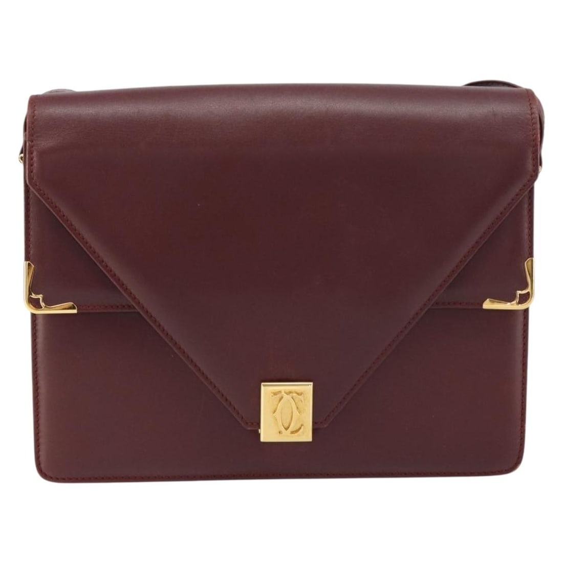 Burgundy Leather Shoulder Bag by Cartier Must de Cartier: Burgundy Leather Shoulder Bag by Cartier Must de Cartier This pre-owned burgundy leather shoulder bag is designed for women and features a classic silhouette from the Must de Cartier collection. Craft