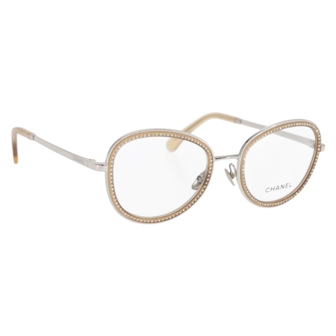 Beige Metal Chanel Sunglasses Model KA2082 with Case Made in Italy: Beige Metal Chanel Sunglasses Model KA2082 with Case Made in Italy These CHANEL sunglasses feature a beige metal frame crafted in Italy. The design includes metal exterior material and comes with a su
