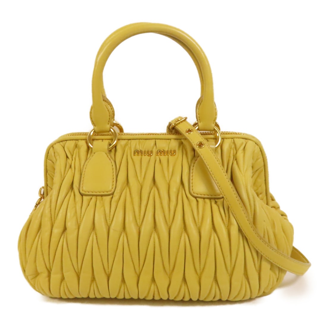 Miu Miu Yellow Lambskin Matelasse 2way Shoulder Bag with Gold Hardware: Miu Miu Yellow Lambskin Matelasse 2way Shoulder Bag with Gold Hardware This Miu Miu 2-way shoulder bag features luxurious yellow lambskin leather with a distinctive matelasse design. The bag can be wo
