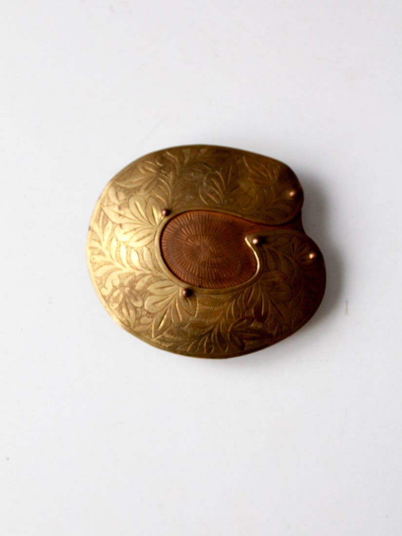 Vintage Large Brass Copper Hippie Buckle Abstract Design: Vintage Large Brass Copper Hippie Buckle Abstract Design This vintage hippie buckle showcases a unique abstract foliage design crafted from brass and copper. The large metal-work buckle features two d