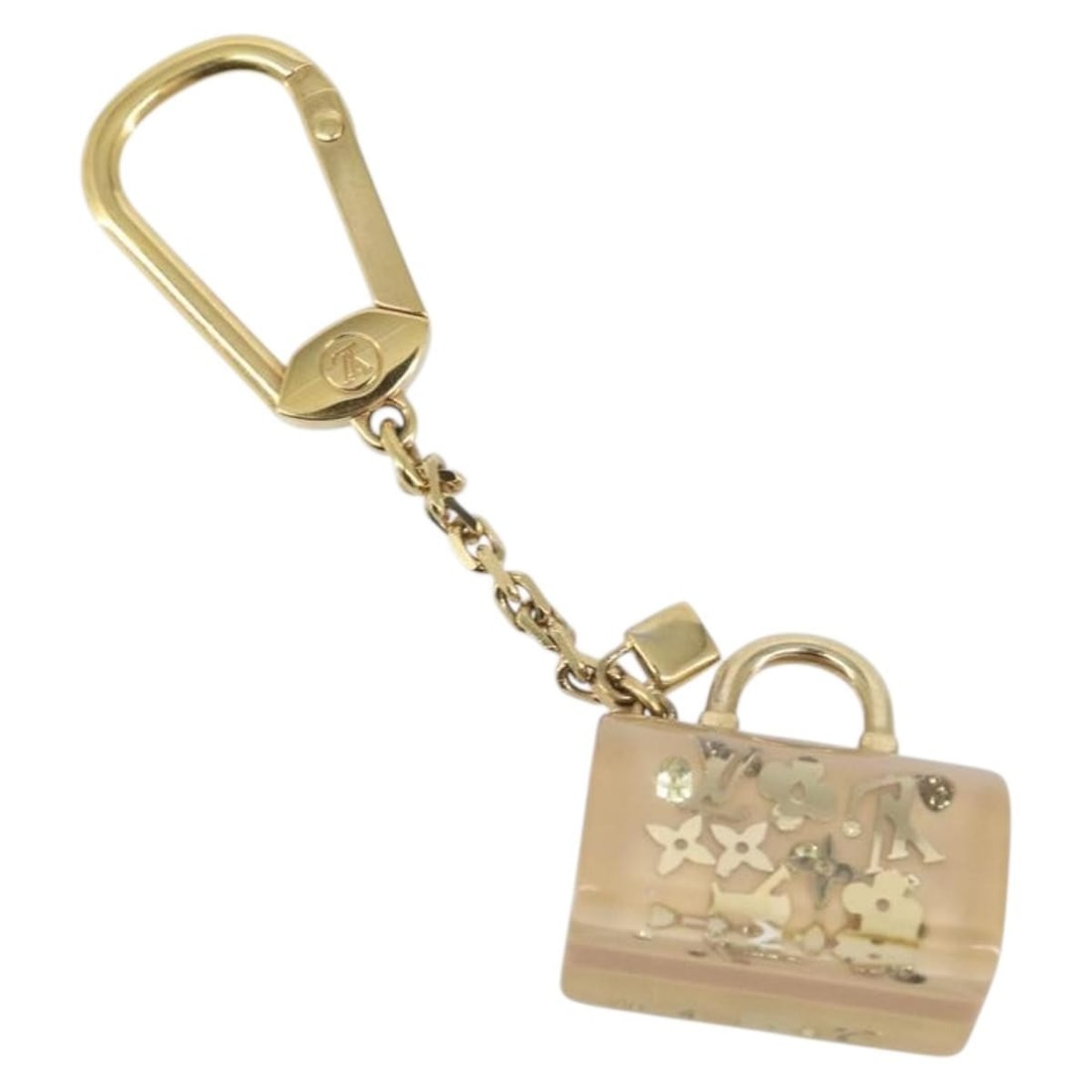 Speedy Unclusion Gold Tone Charm by Louis Vuitton M65416 Plastic: Speedy Unclusion Gold Tone Charm by Louis Vuitton M65416 Plastic This Louis Vuitton Porte Cles Speedy Unclusion charm features a white and gold tone design crafted from plastic. It is a stylish access