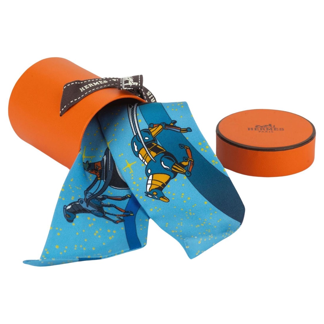 Hermes New Silk Space Derby Twilly Handbag Accessory: Hermes New Silk Space Derby Twilly Handbag Accessory Introducing the Hermes New Silk "Space Derby" Twilly, a versatile and elegant accessory crafted from luxurious silk. Measuring 2 inches in height