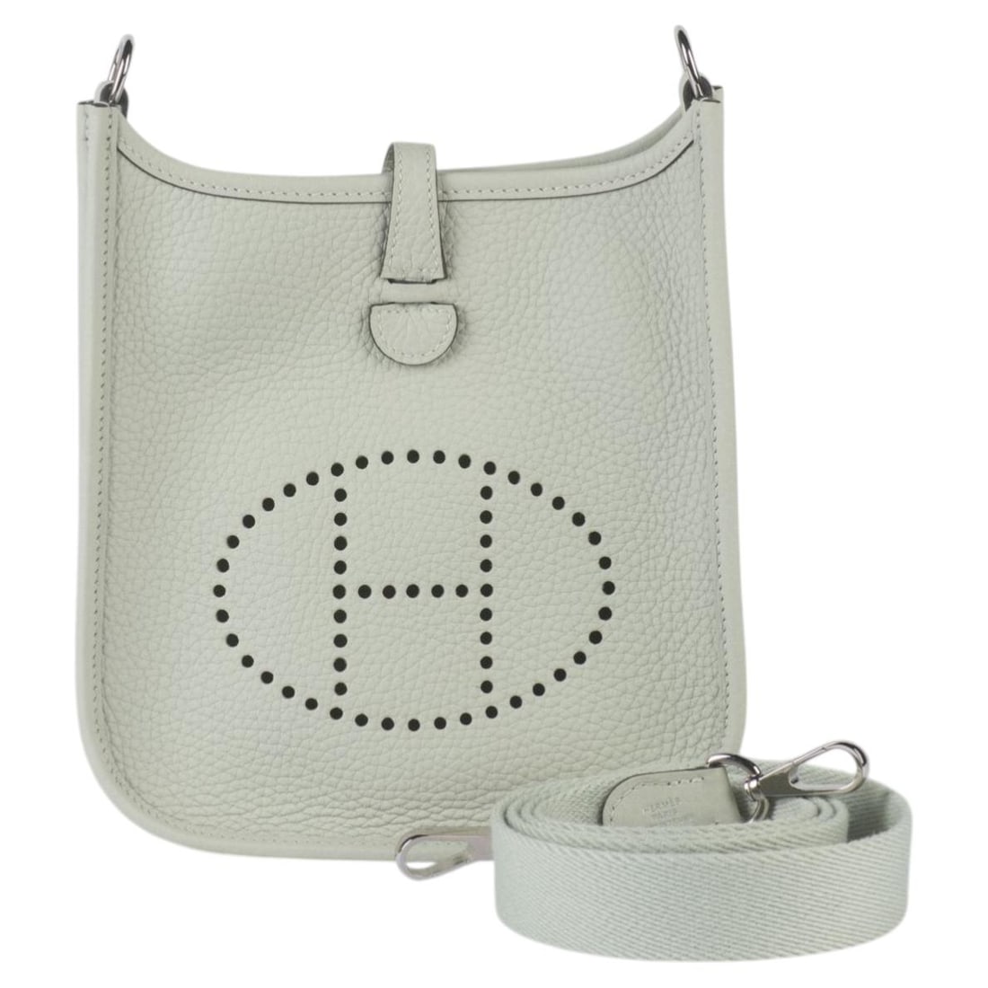Grey Pearl Hermes Mini Evelyne Leather Shoulder Bag with Palladium Hardware: Grey Pearl Hermes Mini Evelyne Leather Shoulder Bag with Palladium Hardware This Hermes Mini Evelyne Bag in grey pearl leather features a perforated logo detail, adjustable shoulder strap, snap fasten