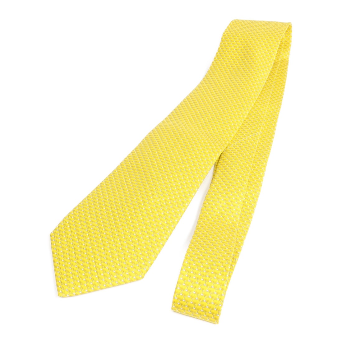Yellow Silk Tie from Hermes France: Yellow Silk Tie from Hermes France This Hermes tie is crafted from high-quality yellow silk and features a classic regular size. Made in France, it offers a refined and elegant accessory choice. Speci