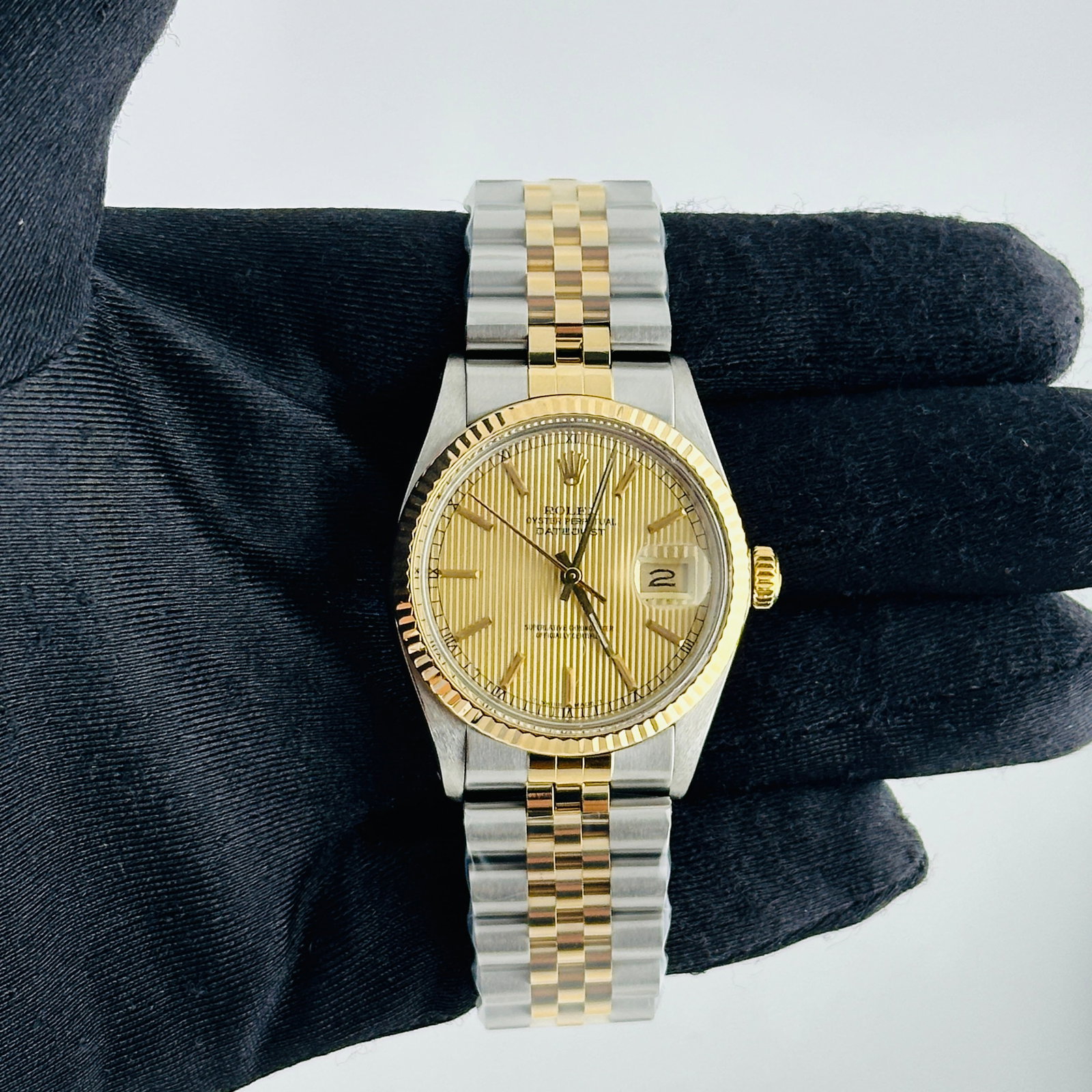 Datejust Ref 16013 Champagne Tapestry Dial Mens Watch with Aftermarket Jubilee Bracelet: Datejust Ref 16013 Champagne Tapestry Dial Mens Watch with Aftermarket Jubilee Bracelet This Rolex Datejust features a champagne tapestry dial and a fluted bezel, complemented by an aftermarket Jubile