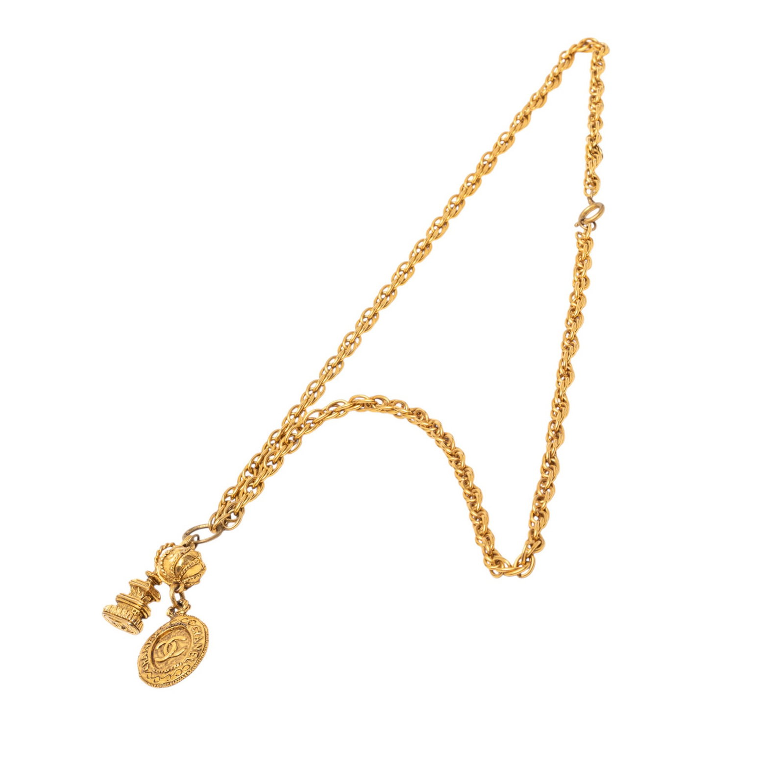 Chanel Medallion and Pagoda Pendant Necklace in Gold Tone Metal: Chanel Medallion and Pagoda Pendant Necklace in Gold Tone Metal This Chanel necklace features a gold tone metal body with medallion and pagoda pendants, secured by a spring ring closure. The necklace 