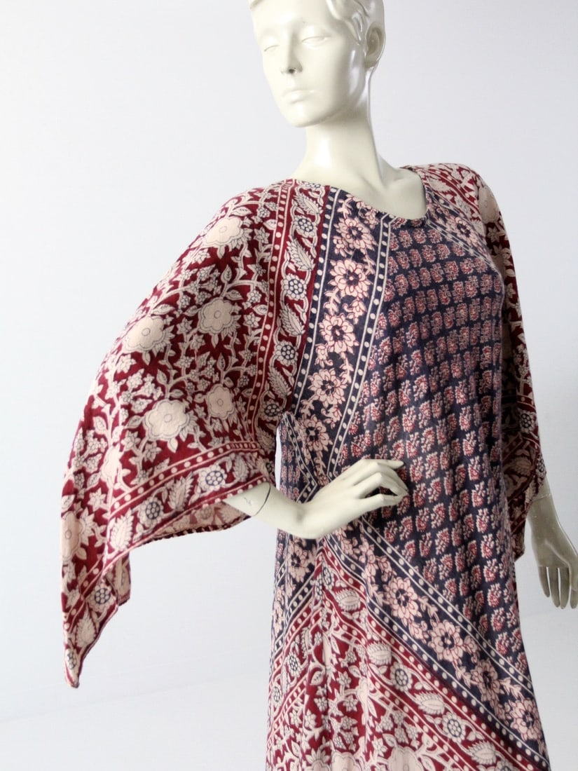 Vintage 1970s Boho Block Print Caftan Maxi Dress: Vintage 1970s Boho Block Print Caftan Maxi Dress Embrace the boho spirit with this stunning vintage 1970s block print caftan maxi dress. Crafted from soft and airy Indian cotton, it showcases a beauti