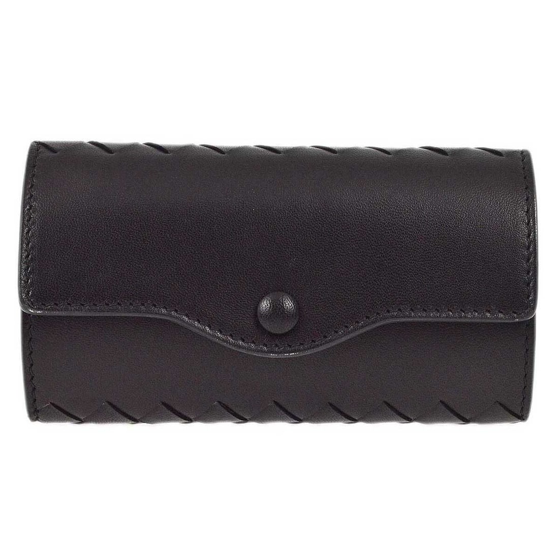 Vintage Black Leather Intrecciato Key Organizer by Bottega Veneta: Vintage Black Leather Intrecciato Key Organizer by Bottega Veneta This Bottega Veneta Intrecciato key case is crafted from black leather and features the brand's signature woven design. Designed for w