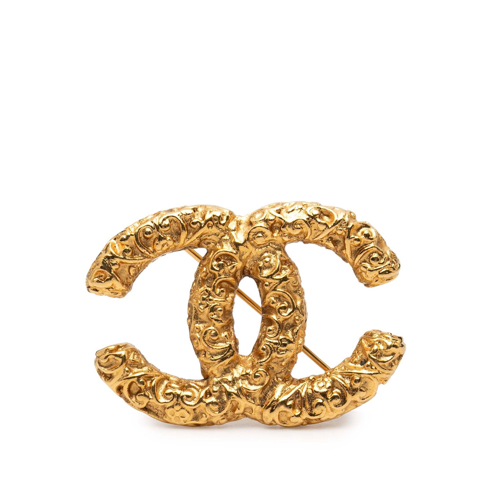 Gold Tone Metal Baroque Embossed Logo Brooch by Chanel CC: Gold Tone Metal Baroque Embossed Logo Brooch by Chanel CC This Chanel brooch features a gold-plated metal body with an embossed baroque-style logo and is secured with a pin back closure. It is a costu