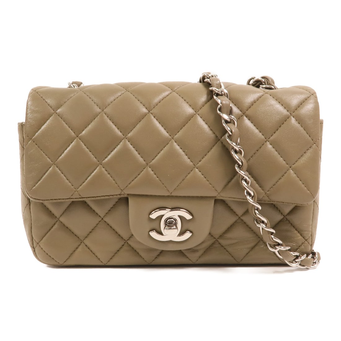 Chanel Mini Classic Shoulder Bag in Green Lambskin with Silver Hardware: Chanel Mini Classic Shoulder Bag in Green Lambskin with Silver Hardware This Chanel Mini Classic 20 chain shoulder bag features a stylish green lambskin leather exterior. Designed for women, it offers