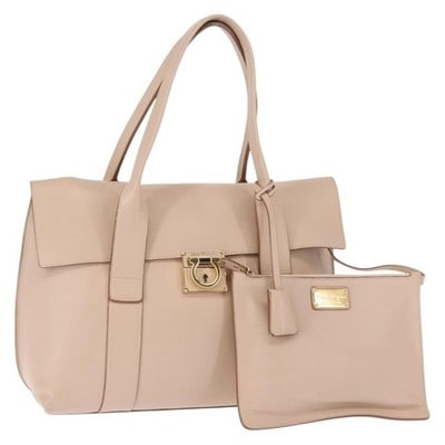 Ferragamo Gancini Pink Gold Leather Shoulder Bag with Pouch: Ferragamo Gancini Pink Gold Leather Shoulder Bag with Pouch This Salvatore Ferragamo Gancini shoulder bag is crafted from pink leather with gold-tone accents. It features a structured silhouette with 